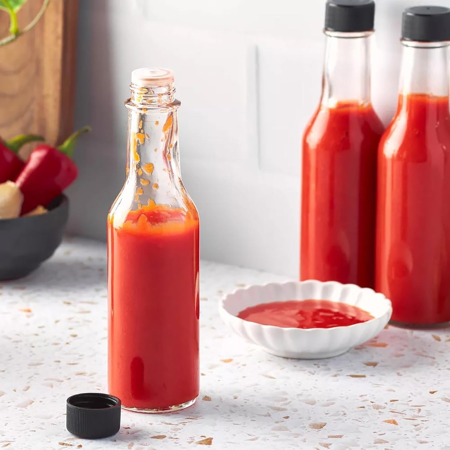 Ahhute Sauce Bottles, 5oz Small Olive Oil Bottles with Shrink Capsules, Mini Vanilla Wine Bottle for Wedding Favors Gifts, Glass Hot Sauce Bottles w/Black Caps and Silicone Funnel, Set of 24